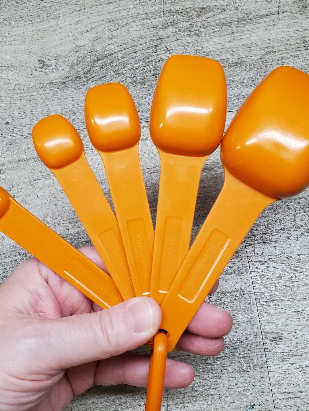 Vintage Tupperware orange measuring spoons